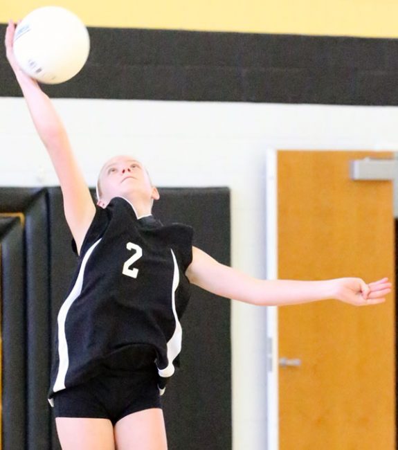 A strong serve in the Middle School match against the Cavaliers led to a strong win.